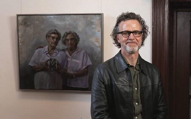 Winner Andrew Greensmith with his painting Two lives one soul, featuring Holocaust survivors Annetta Able and Stephanie Heller. Winner Andrew Greensmith with his painting Two lives one soul, featuring Holocaust survivors Annetta Able and Stephanie Heller.
