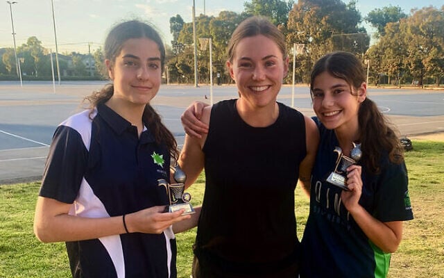 Jasmin Filer (left) and Mia Cashmore (right) receive their U15 Div 1 Spirit of Netball trophies from Maccabi coach Amy Rockman (centre). Jasmin Filer (left) and Mia Cashmore (right) receive their U15 Div 1 Spirit of Netball trophies from Maccabi coach Amy Rockman (centre).