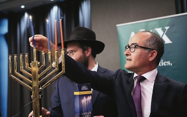 Deputy premier James Merlino lighting the chanukiah on Tuesday night.Photo: Peter Haskin Deputy premier James Merlino lighting the chanukiah on Tuesday night.Photo: Peter Haskin