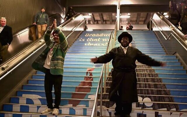 Kosha Dillz (left) and Nissim Black in the video for The Hanukkah Song 2.0.Photo: Screenshot. Kosha Dillz (left) and Nissim Black in the video for The Hanukkah Song 2.0.Photo: Screenshot.