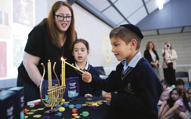 Chanukah candle lighting at The King David School with candles donated by The Joint. Photo: Peter Haskin Chanukah candle lighting at The King David School with candles donated by The Joint. Photo: Peter Haskin