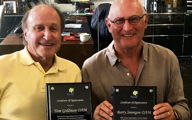 Tom Goldman (left) and Barry Smorgon with their awards at the 2021 Maccabi Australia AGM. Tom Goldman (left) and Barry Smorgon with their awards at the 2021 Maccabi Australia AGM.