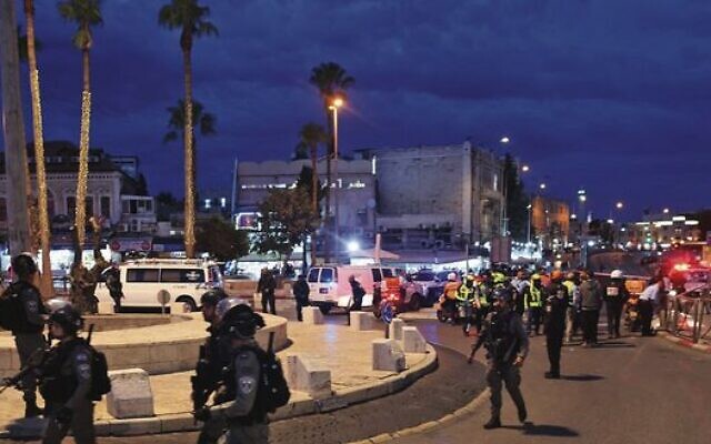 Israeli police gather outside Damascus Gate after Saturday's attack.
Photo: Ahmad Gharabli/AFP via Getty Images Israeli police gather outside Damascus Gate after Saturday's attack.
Photo: Ahmad Gharabli/AFP via Getty Images