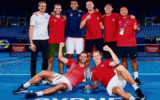 Denis Shapovalov (front on right) and his Canadian teammates celebrate winning the 2022 ATP Cup final in Sydney. Photo: Brett Hemmings/ATP Denis Shapovalov (front on right) and his Canadian teammates celebrate winning the 2022 ATP Cup final in Sydney. Photo: Brett Hemmings/ATP