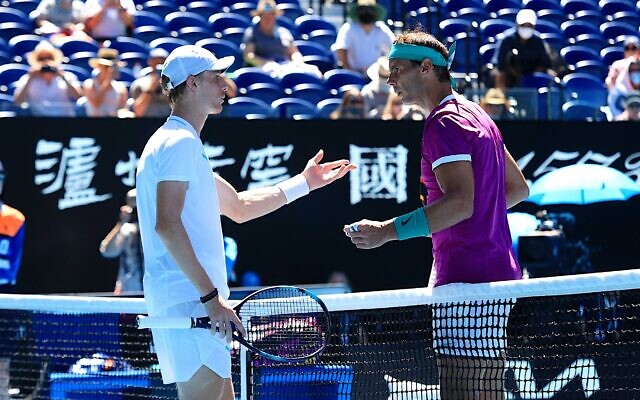 Denis Shapovalov (left) and Rafael Nadal having a mid-match netside chat to try to resolve a disputed issue during their quarter-final match on January 25 in Rod Laver Arena. Photo: Peter Haskin Denis Shapovalov (left) and Rafael Nadal having a mid-match netside chat to try to resolve a disputed issue during their quarter-final match on January 25 in Rod Laver Arena. Photo: Peter Haskin