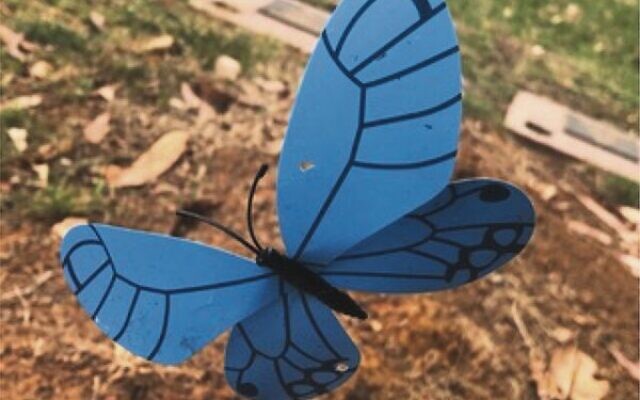 The toy butterfly on a baby's grave at Springvale Cemetery. The toy butterfly on a baby's grave at Springvale Cemetery.