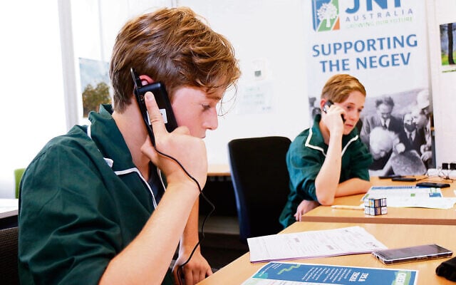 2020 JNF Green Sunday appeal at the JNF office. Brother’s Zach (left) and Mitch Baynash, both from Netzer, volunteering their time on the phones. Photo: Peter Haskin 2020 JNF Green Sunday appeal at the JNF office. Brother’s Zach (left) and Mitch Baynash, both from Netzer, volunteering their time on the phones. Photo: Peter Haskin