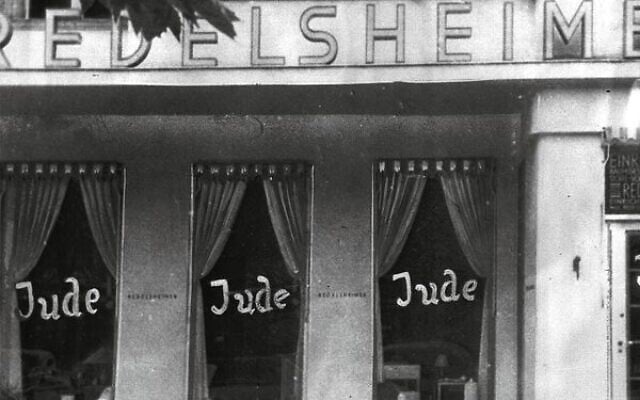 Graffiti on the windows of a shop run by Jews in Berlin in 1938.
Photo: AP Photo Graffiti on the windows of a shop run by Jews in Berlin in 1938.
Photo: AP Photo