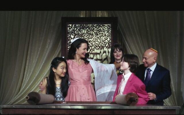 The Goldenblatt family gathers with Rabbi Jen (played by Hari Nef).
Photo: Screenshot The Goldenblatt family gathers with Rabbi Jen (played by Hari Nef).
Photo: Screenshot