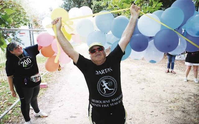 John Zeleznikow celebrates completing his 200th marathon distance run at Princess Park last Sunday. Photo: Peter Haskin John Zeleznikow celebrates completing his 200th marathon distance run at Princess Park last Sunday. Photo: Peter Haskin