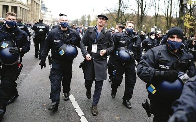 Nikolai Nerling is led away by police during a demonstration against COVID restrictions.Photo: Kay Nietfeld/picture alliance Nikolai Nerling is led away by police during a demonstration against COVID restrictions.Photo: Kay Nietfeld/picture alliance