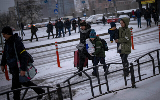 People arrive at a train station as they try to leave Kyiv, Ukraine, Tuesday, March 1, 2022. (AP Photo/Emilio Morenatti) People arrive at a train station as they try to leave Kyiv, Ukraine, Tuesday, March 1, 2022. (AP Photo/Emilio Morenatti)