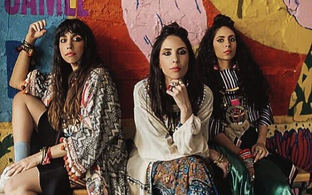The cover of The Flying Camel features A-WA, an Israeli band made up of the three sisters Tair, Liron, and Tagel Haim. Photo: Rotem Lebel. The cover of The Flying Camel features A-WA, an Israeli band made up of the three sisters Tair, Liron, and Tagel Haim. Photo: Rotem Lebel.
