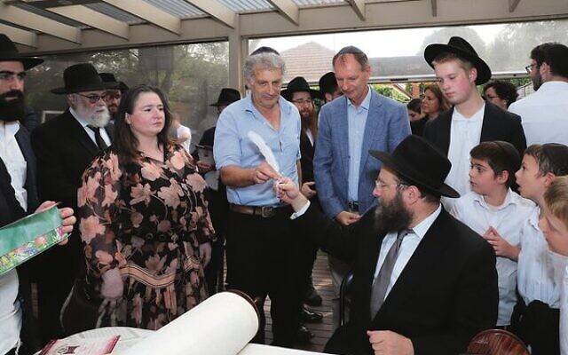 The writing of the final letters in the Sefer Torah. The writing of the final letters in the Sefer Torah.