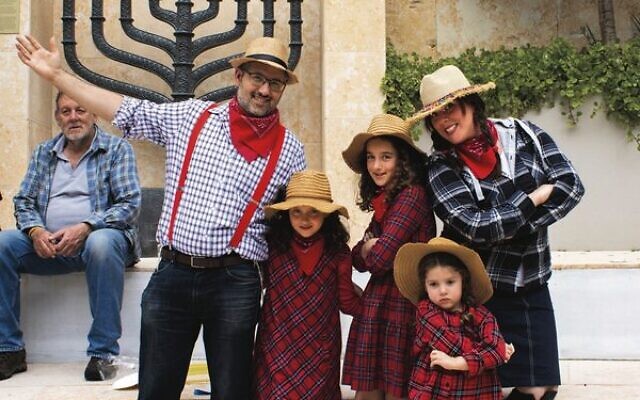 Emmanuel and Rivka Rosenberg with their children. Emmanuel and Rivka Rosenberg with their children.