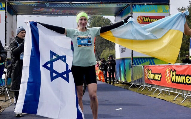 Ukrainian runner Valentyna Veretska celebrates after being the first woman to cross the finish line in the 2022 Jerusalem Marathon on March 25. Photo: AP Photo/Mahmoud Illean, via JTA Ukrainian runner Valentyna Veretska celebrates after being the first woman to cross the finish line in the 2022 Jerusalem Marathon on March 25. Photo: AP Photo/Mahmoud Illean, via JTA