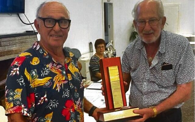 Louis Platus (right) being presented with the Bernie Garden Recognition Award by Shmuel Abrahams. Louis Platus (right) being presented with the Bernie Garden Recognition Award by Shmuel Abrahams.