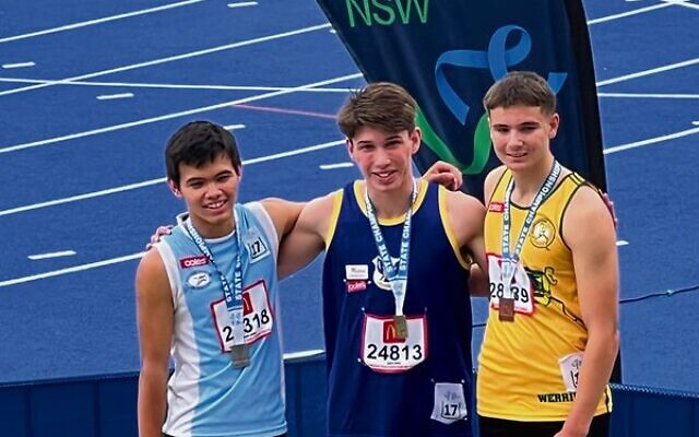 Zac Urbach (centre) after winning gold at the NSW Little Athletics state championships. Zac Urbach (centre) after winning gold at the NSW Little Athletics state championships.