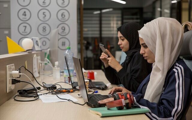 Illustrative: Palestinian entrepreneurs work at a digital tech startup in Ramallah in the West Bank on Oct. 10, 2021. (Ahed Izhiman) Illustrative: Palestinian entrepreneurs work at a digital tech startup in Ramallah in the West Bank on Oct. 10, 2021. (Ahed Izhiman)