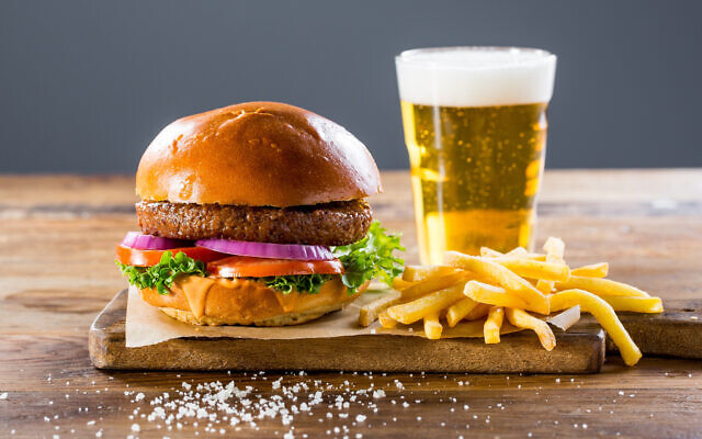 A cultivated beef burger made by Israeli company Future Meat, served with fries and a beer. (Future Meat) A cultivated beef burger made by Israeli company Future Meat, served with fries and a beer. (Future Meat)
