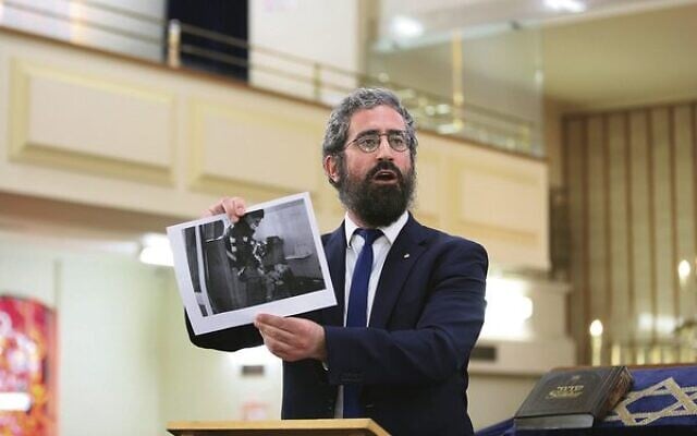Rabbi Yaakov Glasman showing the picture of the Ukrainian girl killed during the Russian invasion.
Photo: Peter Haskin Rabbi Yaakov Glasman showing the picture of the Ukrainian girl killed during the Russian invasion.
Photo: Peter Haskin