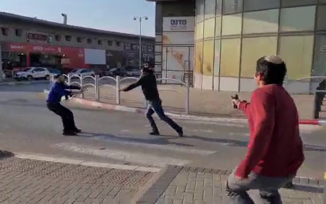 A suspected assailant being shot in Beersheba on March 22, 2022. Photo: Twitter Screenshot A suspected assailant being shot in Beersheba on March 22, 2022. Photo: Twitter Screenshot