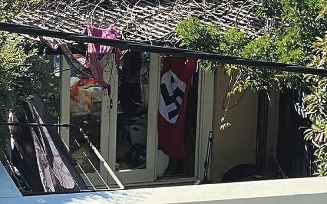 A swastika flag at a home in Newtown, in Sydney's inner-west, in April 2020. A swastika flag at a home in Newtown, in Sydney's inner-west, in April 2020.