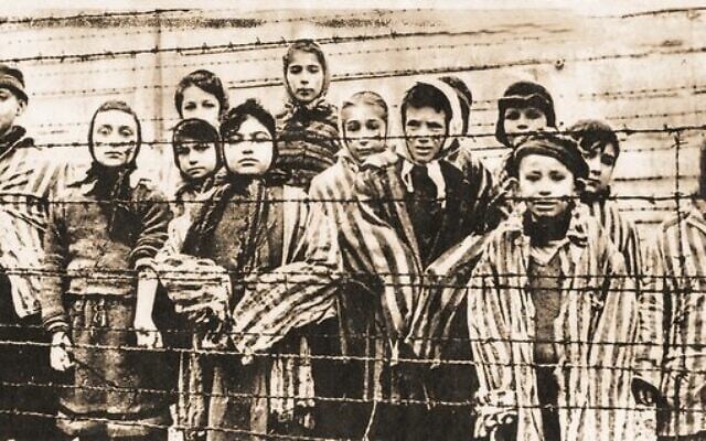 Survivors moments after the Red Army liberated Auschwitz on January 27, 1945. Melbourne survivor Eva Slonim, then 13 years old, is pictured centre front. Survivors moments after the Red Army liberated Auschwitz on January 27, 1945. Melbourne survivor Eva Slonim, then 13 years old, is pictured centre front.