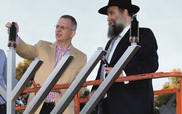 Bradfield MP Paul Fletcher (left) at the 2017 Chanukah on the Green event in St Ives, alongside Rabbi Nochum Schapiro. Photo: Noel Kessel. Bradfield MP Paul Fletcher (left) at the 2017 Chanukah on the Green event in St Ives, alongside Rabbi Nochum Schapiro. Photo: Noel Kessel.