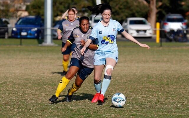 Maccabi FC Caulfield's Aicha Phipps-Booth dribbles ahead of a Noble Hurricanes defender last Sunday at Alex Nelson Reserve, Springvale. Photo: Peter Haskin Maccabi FC Caulfield's Aicha Phipps-Booth dribbles ahead of a Noble Hurricanes defender last Sunday at Alex Nelson Reserve, Springvale. Photo: Peter Haskin