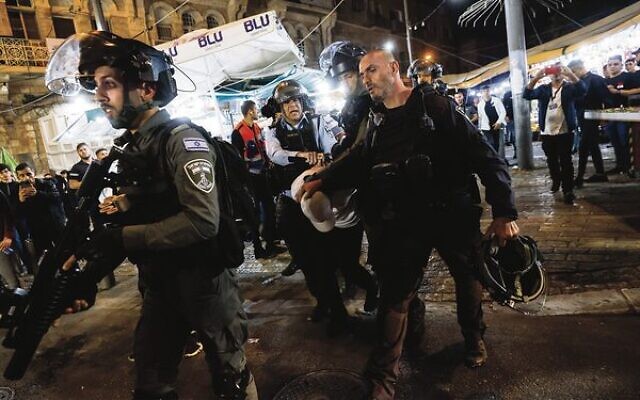 Israeli police officers during clashes with protesters at Damascus Gate in Jerusalem's Old City on April 5. Photo: Olivier Fitoussi/Flash90 Israeli police officers during clashes with protesters at Damascus Gate in Jerusalem's Old City on April 5. Photo: Olivier Fitoussi/Flash90