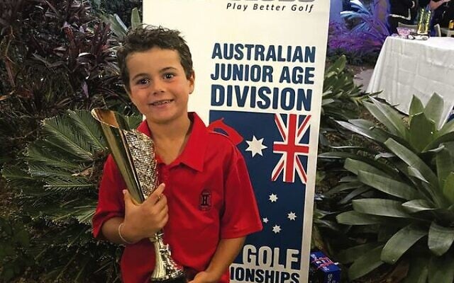 Zac Wolfe holding his 2022 U7 national golf trophy in the Gold Coast last weekend. Zac Wolfe holding his 2022 U7 national golf trophy in the Gold Coast last weekend.