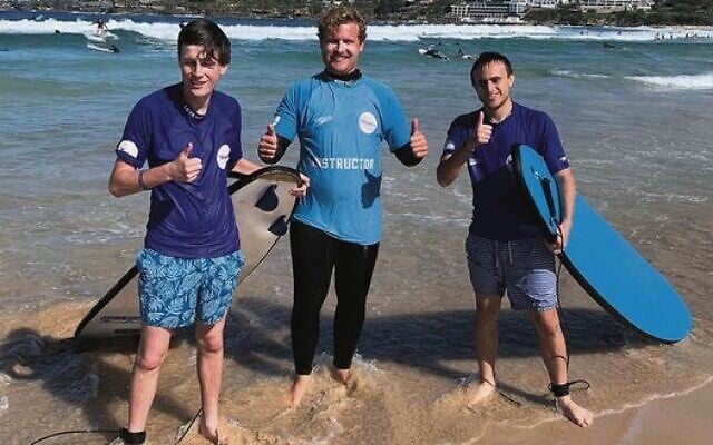 Maccabi NSW All Abilities Surf's Up participants Will Gibbons (left) and Jarred Morris (right) with their instructor at Bondi Beach on May 1. Maccabi NSW All Abilities Surf's Up participants Will Gibbons (left) and Jarred Morris (right) with their instructor at Bondi Beach on May 1.