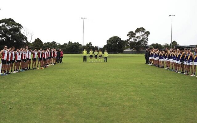 AJAX and Williamstown CYMS men's players hold a minute's silence before their match last Saturday at Moorleigh Reserve, to mark Yom Hashoah. Photo: Peter Haskin AJAX and Williamstown CYMS men's players hold a minute's silence before their match last Saturday at Moorleigh Reserve, to mark Yom Hashoah. Photo: Peter Haskin