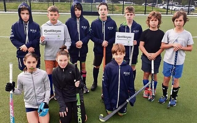 Maccabi Hockey Club juniors holding their #JustLikeYou signs. Maccabi Hockey Club juniors holding their #JustLikeYou signs.