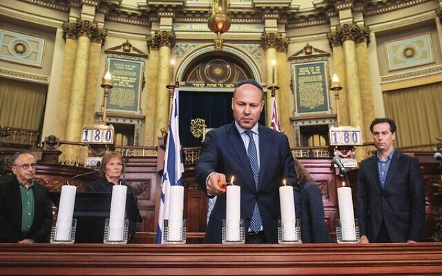 Federal Treasurer Josh Frydenberg lights a memorial candle at Melbourne Hebrew Congregation on Yom Hashoah. Photo: Adam R. Thomas Federal Treasurer Josh Frydenberg lights a memorial candle at Melbourne Hebrew Congregation on Yom Hashoah. Photo: Adam R. Thomas