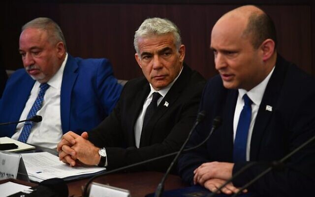 Naftali Bennett, right, sitting alongside Yair Lapid, centre, and Finance Minister Avigdor Lieberman, leads a cabinet meeting at the Prime Minister's Office in Jerusalem on June 26.
Photo: Yoav Dudkevitch Naftali Bennett, right, sitting alongside Yair Lapid, centre, and Finance Minister Avigdor Lieberman, leads a cabinet meeting at the Prime Minister's Office in Jerusalem on June 26.
Photo: Yoav Dudkevitch
