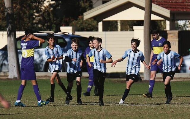 Maccabi FC Caulfield U14 Orange teammates celebrate a goal in their first round win last Saturday at Caulfield Park. Photo: Peter Haskin Maccabi FC Caulfield U14 Orange teammates celebrate a goal in their first round win last Saturday at Caulfield Park. Photo: Peter Haskin