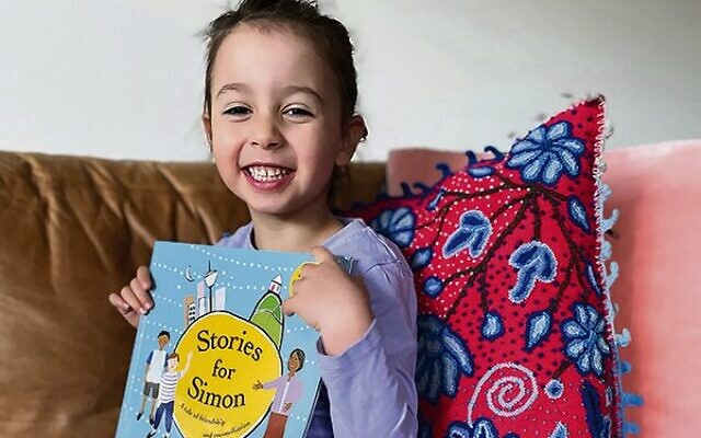Selah Gregor receiving her Stories for Simon book. Selah Gregor receiving her Stories for Simon book.