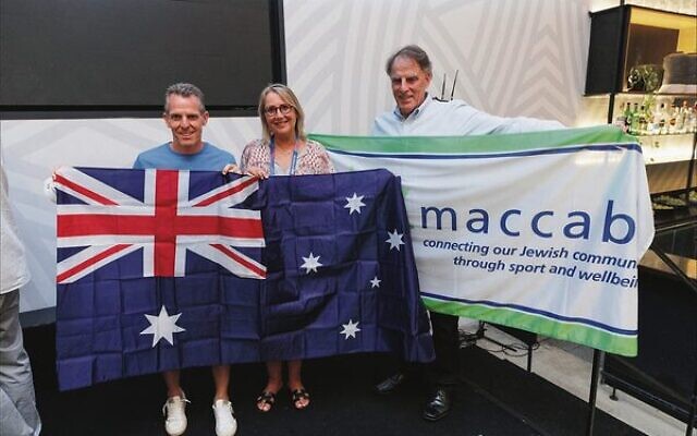 From left: Australian co-flagbearers for the opening ceremony, Jon Pillemer and Lauren Ehrlich, and Maccabi Australia flagbearer, Jeff Sher. Photo: Maccabi Australia Team Media From left: Australian co-flagbearers for the opening ceremony, Jon Pillemer and Lauren Ehrlich, and Maccabi Australia flagbearer, Jeff Sher. Photo: Maccabi Australia Team Media