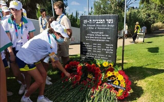 Left: Australian team members laying wreaths and flowers at the 1997 Maccabiah Games bridge collapse memorial stone in Ramat Gan on July 11.
Right: The audience at the bridge memorial ceremony beside the Yarkon River. Left: Australian team members laying wreaths and flowers at the 1997 Maccabiah Games bridge collapse memorial stone in Ramat Gan on July 11.
Right: The audience at the bridge memorial ceremony beside the Yarkon River.
