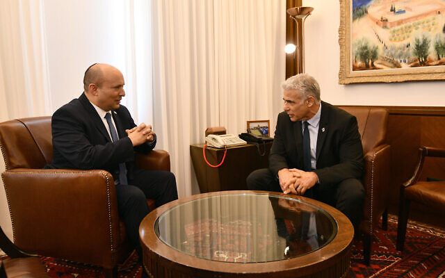 Prime Minister Naftali Bennett briefs his successor Yair Lapid at the Prime Minister’s Office, June 30, 2022. Photo: Haim Zach / GPO Prime Minister Naftali Bennett briefs his successor Yair Lapid at the Prime Minister’s Office, June 30, 2022. Photo: Haim Zach / GPO