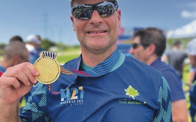Guy Miller with his gold medal in the men's 50-54 individual time trial event. Guy Miller with his gold medal in the men's 50-54 individual time trial event.