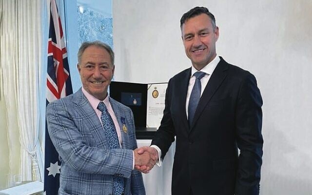 Australia's ambassador to Israel Paul Griffiths presents Danny Hakim with an Order of Australia (OAM) medal. Australia's ambassador to Israel Paul Griffiths presents Danny Hakim with an Order of Australia (OAM) medal.