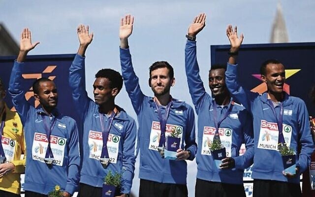 From left: Israeli marathon team members Marhu Teferi, Gashau Ayale, Omer Ramon, Yimer Getahun and Girmaw Amare with their gold medals in Munich on August 15. Photo: Ina Fassbender/AFP From left: Israeli marathon team members Marhu Teferi, Gashau Ayale, Omer Ramon, Yimer Getahun and Girmaw Amare with their gold medals in Munich on August 15. Photo: Ina Fassbender/AFP