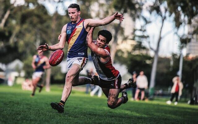 This desperate tackle by AJAX captain Nick Lewis prevented a St Bedes-Mentone Tigers player from scoring a winning goal in both teams' last match of the VAFA Premier B men's season last Saturday at Gary Smorgon Oval. The match ended in a draw. Photo: Jack Dilks This desperate tackle by AJAX captain Nick Lewis prevented a St Bedes-Mentone Tigers player from scoring a winning goal in both teams' last match of the VAFA Premier B men's season last Saturday at Gary Smorgon Oval. The match ended in a draw. Photo: Jack Dilks