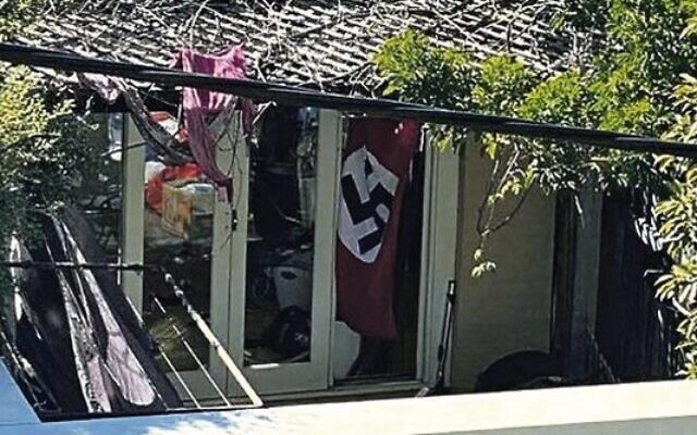 A swastika flag at a home in Newtown, in Sydney's inner-west, in April 2020. A swastika flag at a home in Newtown, in Sydney's inner-west, in April 2020.