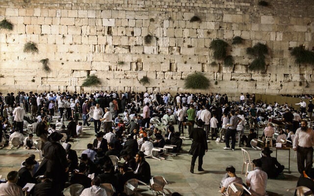 Orthdox Jews men pray as they gather for the ritual of Tisha B'Av at the Wall Western in the Old City of Jerusalem, July28, 2012. The Tisha B'Av ceremony, literally the ninth day of the month of Av in the Hebraic calendar, is the darkest day in the Jewish calendar, marking the destruction of the two temples, first by the Babylonians in 587 BC and later by the Romans in 70 AD. Photo by Noam Moskowitz / Flash90. Orthdox Jews men pray as they gather for the ritual of Tisha B'Av at the Wall Western in the Old City of Jerusalem, July28, 2012. The Tisha B'Av ceremony, literally the ninth day of the month of Av in the Hebraic calendar, is the darkest day in the Jewish calendar, marking the destruction of the two temples, first by the Babylonians in 587 BC and later by the Romans in 70 AD. Photo by Noam Moskowitz / Flash90.