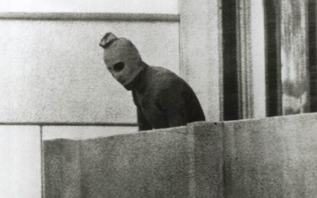 One of the defining images of the Munich Olympics in 1972: a member of the group that had taken the Israelis hostage seen on the apartment balcony in a face mask. Photo: Russell Mcphedran/The Sydney Morning Herald/Fairfax Media via Getty Images One of the defining images of the Munich Olympics in 1972: a member of the group that had taken the Israelis hostage seen on the apartment balcony in a face mask. Photo: Russell Mcphedran/The Sydney Morning Herald/Fairfax Media via Getty Images