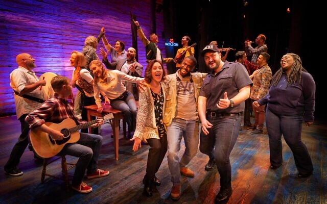 The cast and band members in full voice in Come From Away. Photo: Jeff Busby The cast and band members in full voice in Come From Away. Photo: Jeff Busby
